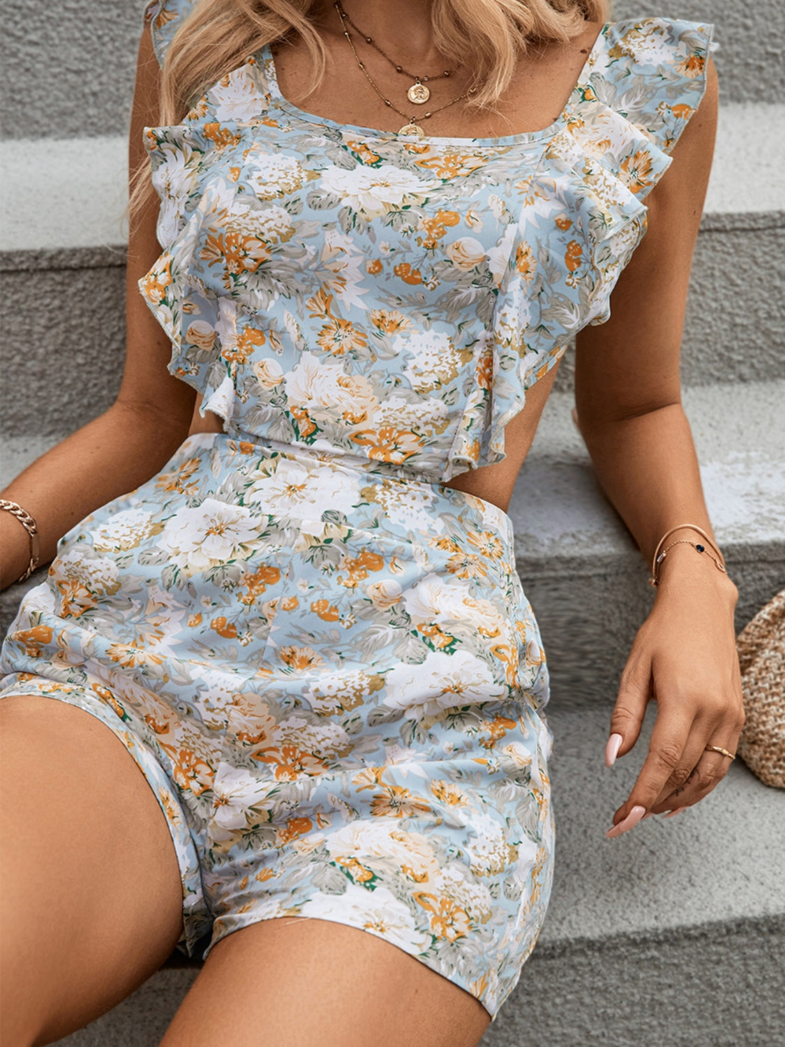 DEVON BACKLESS FLORAL ROMPER